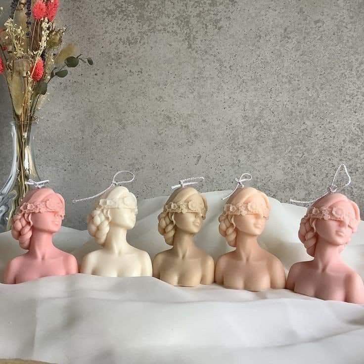 Blindfolded girl candle