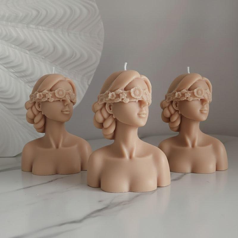 Blindfolded girl candle