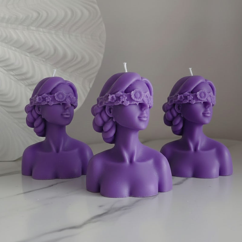 Blindfolded girl candle