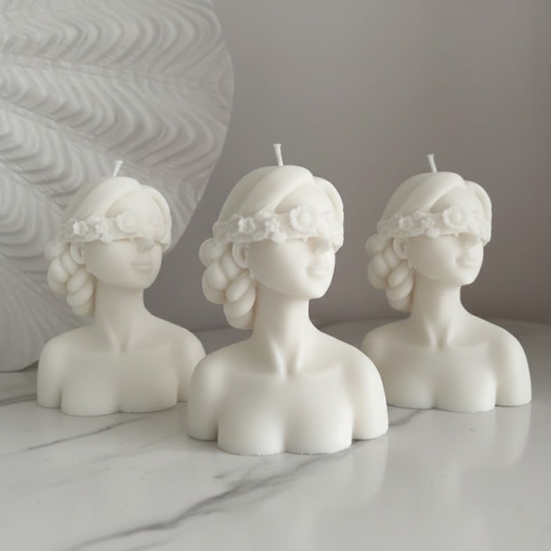 Blindfolded girl candle