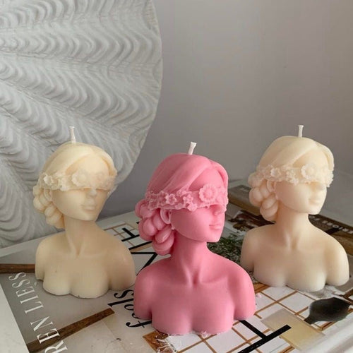 Blindfolded girl candle